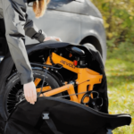 Revolt Carbon Fiber Pro V2 Chain Drive E-Bike , Rear Suspension, Female, Pale Orange, Trolley Bag