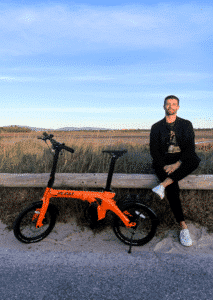 Revolt Carbon Fiber Pro V3, Mid Motor, Belt Drive E-Bike, Orange, Male, Trailblazer T-Shirt Navy Blue